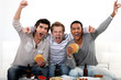 Friends watching a football game together