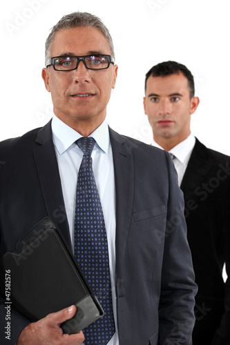 Photo: Businessman with young apprentice Businessman with young apprentice