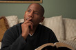 Photo: African American Studying the Bible at Home African American Studying the Bible at Home