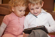 Foto: Two kids with digital tablet Two kids with digital tablet
