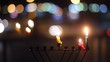 Beautiful candles and hanukkah menorah with defocus background