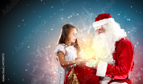 Photo: portrait of santa claus with a girl portrait of santa claus with a girl