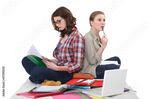 Photo: female students cramming for exam female students cramming for exam
