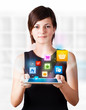 Young woman looking at modern tablet with colourful icons