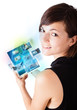 Young woman browsing pictures on modern tablet