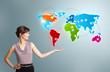 Young woman presenting colorful world map
