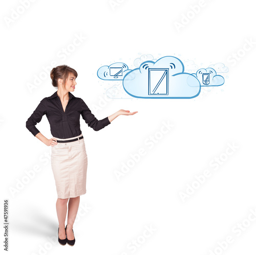 Photo: young woman presenting modern devices in clouds young woman presenting modern devices in clouds