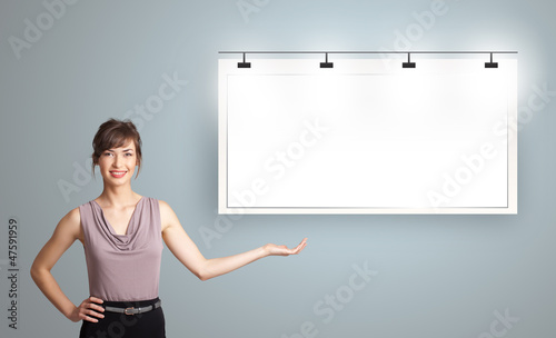 Photo: young woman presenting modern copy space young woman presenting modern copy space