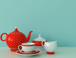 Red dishware on a blue background