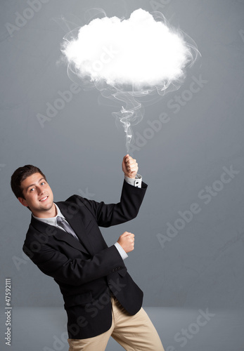 Photo: Young man holding cloud Young man holding cloud