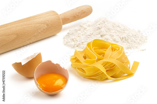 Photo: fettuccine, eggs, flour and wooden rolling pin fettuccine, eggs, flour and wooden rolling pin