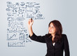 Photo: Woman drawing business scheme and icons on whiteboard Woman drawing business scheme and icons on whiteboard