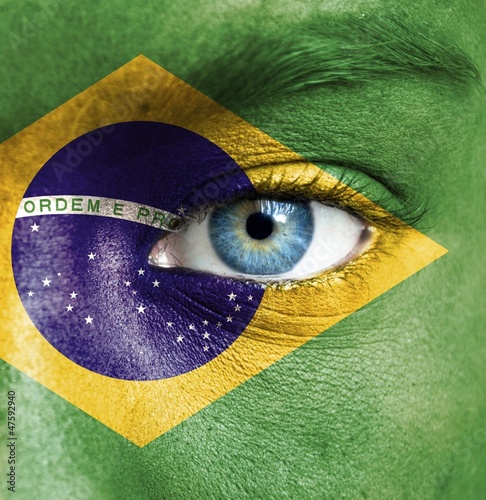Photo: Human face painted with flag of Brazil Human face painted with flag of Brazil