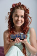 smiling woman holding a gift