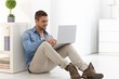 Young man using laptop at home