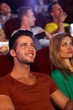 Closeup portrait of young man in cinema