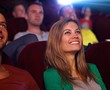 Foto: Closeup portrait of attractive woman in cinema Closeup portrait of attractive woman in cinema
