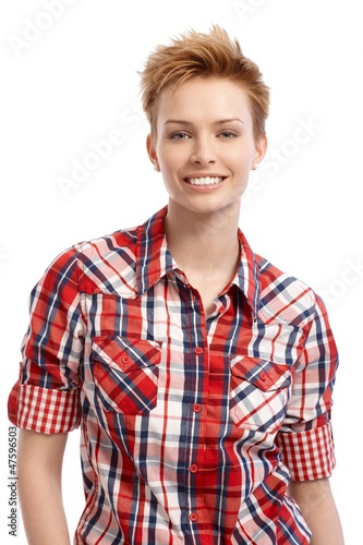 Photo: Portrait of young woman in shirt smiling Portrait of young woman in shirt smiling