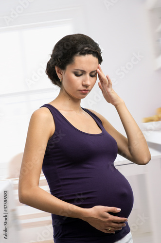 Photo: Pregnant woman with headache Pregnant woman with headache