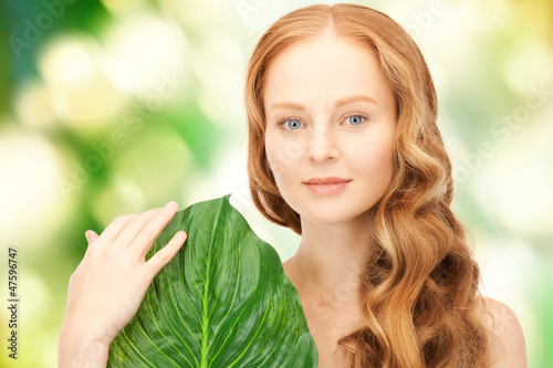 Photo: woman with green leaf woman with green leaf