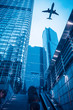 Photo: modern building with airplane at dusk modern building with airplane at dusk