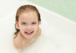 Cute little girl is taking a bath