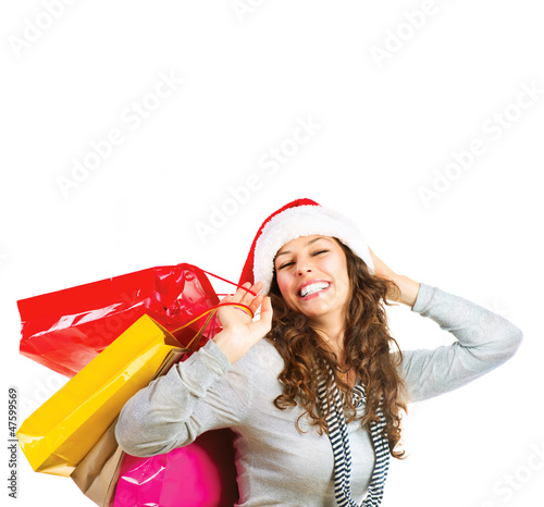 Photo: Christmas Shopping. Woman with Bags over White. Sales Christmas Shopping. Woman with Bags over White. Sales