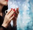 Woman Holding a Hot Beverage