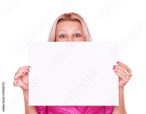 Photo: Blonde holding blank paper Blonde holding blank paper