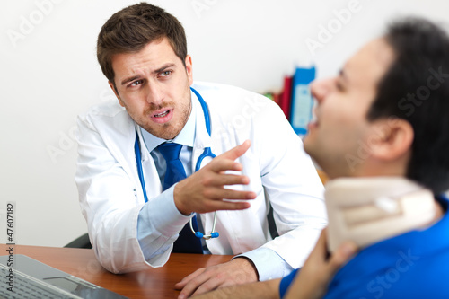 Photo: Doctor visiting a patient in his studio Doctor visiting a patient in his studio