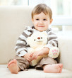 Portrait of a little boy with his teddy bear
