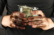 homeless holds bank with money, close-up