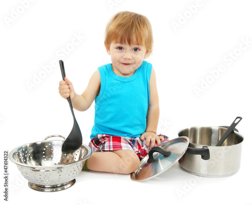 Photo: cute little boy with kitchen accessories, isolated on white cute little boy with kitchen accessories, isolated on white