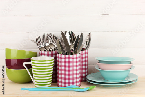 Photo: Cups, bowls nd other utensils in metal containers isolated Cups, bowls nd other utensils in metal containers isolated