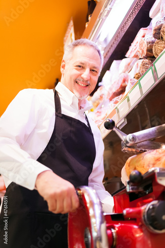 Photo: Shopkeeper at work in a grocery store Shopkeeper at work in a grocery store