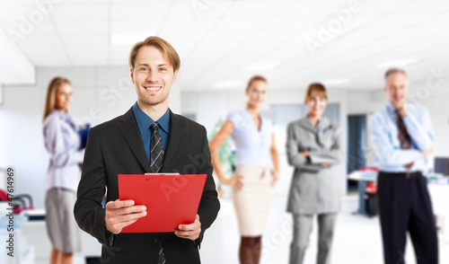 Photo: Businessman reading a document Businessman reading a document