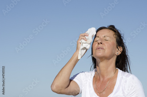 Photo: Mature woman menopause stress sweating Mature woman menopause stress sweating