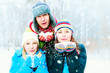 Family Outdoors. Happy Family Blowing Snow