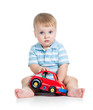 funny boy kid playing with toy car