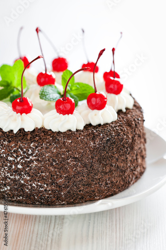 Photo: Chocolate cake with whipped cream and glazed cherries Chocolate cake with whipped cream and glazed cherries