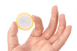 Photo: Hand with condom isolated on white Hand with condom isolated on white