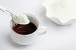 Cup of tea with dairy milk powder
