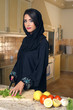 Arabian Lady Wearing Hijab Cutting Veggies for Salad