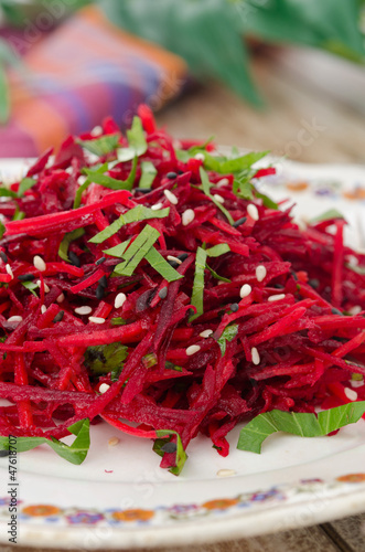 Photo: salad of fresh beets and carrots with parsley closeup salad of fresh beets and carrots with parsley closeup
