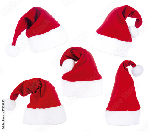 Photo: 5 Santa Claus Hats isolated on white 5 Santa Claus Hats isolated on white