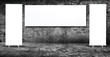 Blank advertising billboard in cement wall room.