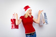 beautiful blonde woman holding a christmas gift is smiling