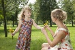 girl gives a flowers mother