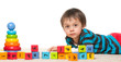 Little boy near blocks with alphabet