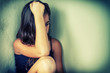 Bleached vintage portrait of a sad and lonely teenager